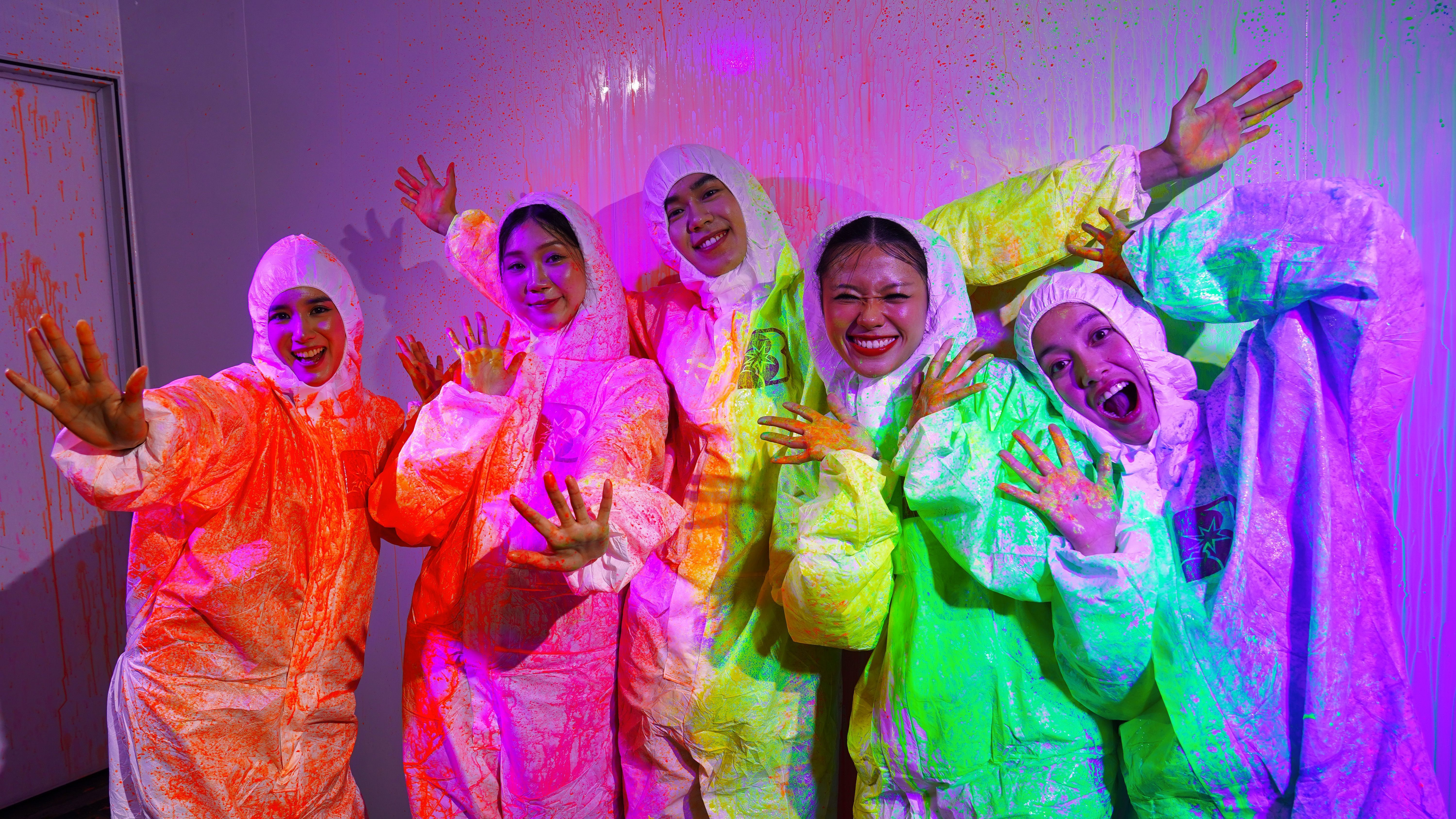 5 adults with white uniform are playing the best game in Malaysia by Bomb Battle